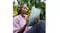 Person using an iPad Air outdoors with Apple Pencil, holding the device against a background of lush green plants Person using an iPad Air outdoors with Apple Pencil, holding the device against a background of lush green plants