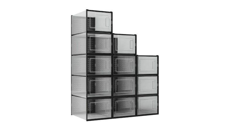Stacked black 12-piece shoe organisers with clear front doors arranged in a stepped layout Stacked black 12-piece shoe organisers with clear front doors arranged in a stepped layout
