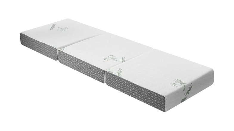 Tri‑fold LUXDREAM mattress laid flat, featuring a white bamboo cover and grey patterned sides Tri‑fold LUXDREAM mattress laid flat, featuring a white bamboo cover and grey patterned sides