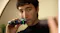 A person shaving the moustache area with the green light ring active A person shaving the moustache area with the green light ring active