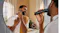 A person trimming in a mirror with a mustard towel A person trimming in a mirror with a mustard towel