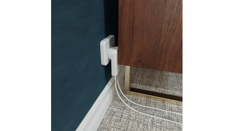 Demonstrating the flush fit of the Cygnett charger behind a gold-legged furniture unit Demonstrating the flush fit of the Cygnett charger behind a gold-legged furniture unit