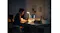 A person working on a laptop at night using a portable power source A person working on a laptop at night using a portable power source