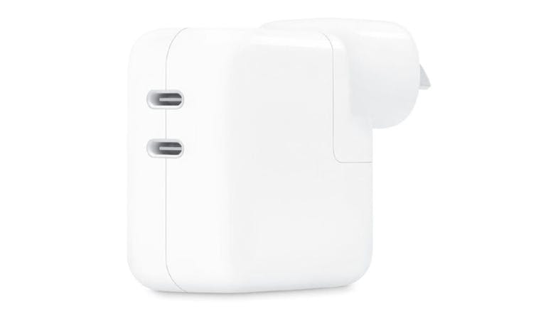 An Apple 35W Dual USB-C Power Adapter in a sleek white colour An Apple 35W Dual USB-C Power Adapter in a sleek white colour