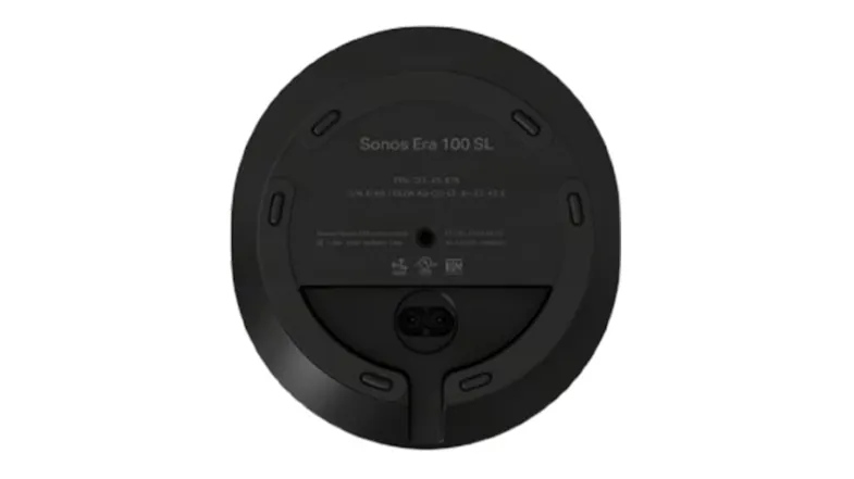 Bottom view of the speaker showing technical labels, mounting hole, and power port Bottom view of the speaker showing technical labels, mounting hole, and power port
