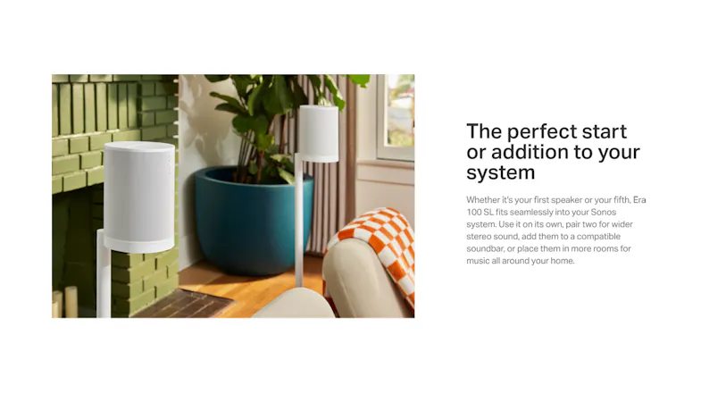 Two white speakers on tall stands in a modern living room Two white speakers on tall stands in a modern living room
