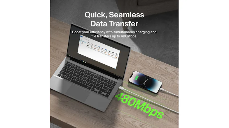 Laptop and phone connected by cable with 480Mbps data transfer Laptop and phone connected by cable with 480Mbps data transfer