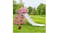 Pink dinosaur‑themed slide set up outdoors on grass with a ball nearby Pink dinosaur‑themed slide set up outdoors on grass with a ball nearby