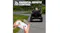 Parental remote control guiding a kid's electric ride-on jeep driving on a paved park path Parental remote control guiding a kid's electric ride-on jeep driving on a paved park path