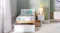 Wooden bed with one drawer closed, and one drawer pulled out Wooden bed with one drawer closed, and one drawer pulled out