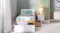 Front view of a bed with a pillow inside an open drawer Front view of a bed with a pillow inside an open drawer