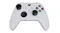A view of a white xbox controller with two black thumb grips attached A view of a white xbox controller with two black thumb grips attached