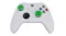 A view of a whiteblack xbox controller with two green thumb grips attached A view of a whiteblack xbox controller with two green thumb grips attached