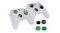 Two xbox controllers displayed along with the thumb grips, some are attached to the analog sticks Two xbox controllers displayed along with the thumb grips, some are attached to the analog sticks