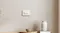 Aqara H2 Horizontal Smart Light Switch mounted on the wall with dual buttons in a modern home interior Aqara H2 Horizontal Smart Light Switch mounted on the wall with dual buttons in a modern home interior