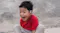 A boy is smiling while wearing JBL open-ear headphones outdoors A boy is smiling while wearing JBL open-ear headphones outdoors