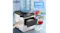 Ice maker with water bottle on top, dispensing cold water and showing ice capacity text Ice maker with water bottle on top, dispensing cold water and showing ice capacity text