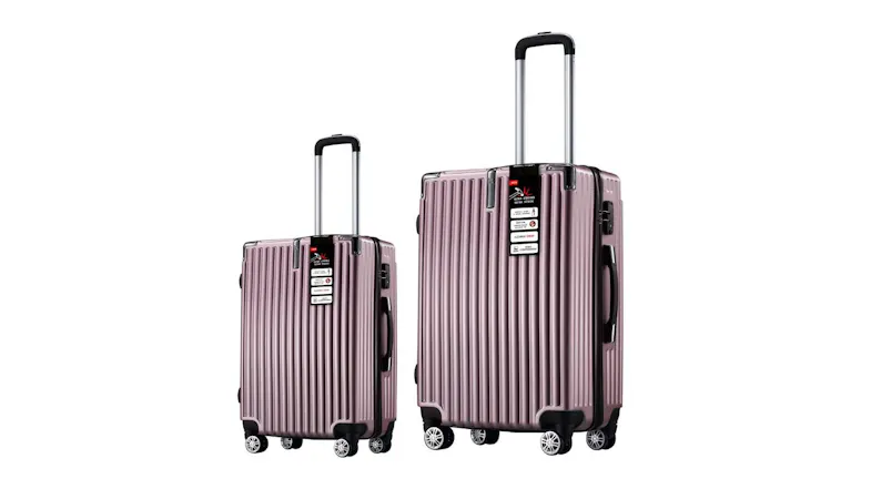 Two rose gold hardshell suitcases, 20‑inch and 28‑inch, standing upright with ridged texture Two rose gold hardshell suitcases, 20‑inch and 28‑inch, standing upright with ridged texture