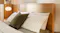 Close-up view of the Jasper bed headboard and pillows Close-up view of the Jasper bed headboard and pillows
