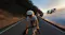 DJI quadcopter drone tracking two cyclists riding at sunset DJI quadcopter drone tracking two cyclists riding at sunset