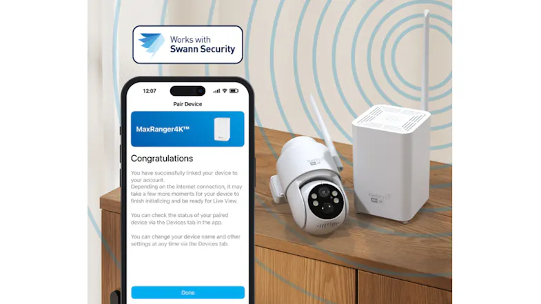 A phone showing successful device pairing next to a camera and hub A phone showing successful device pairing next to a camera and hub