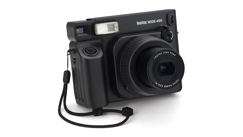 Angled front view of a film camera with lens extended Angled front view of a film camera with lens extended