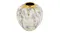 A rounded white vase with distressed grey patterns and a reflective gold top where gold drips flow down the sides A rounded white vase with distressed grey patterns and a reflective gold top where gold drips flow down the sides