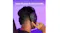 Rear view of a person wearing the headset and adjusting the volume Rear view of a person wearing the headset and adjusting the volume