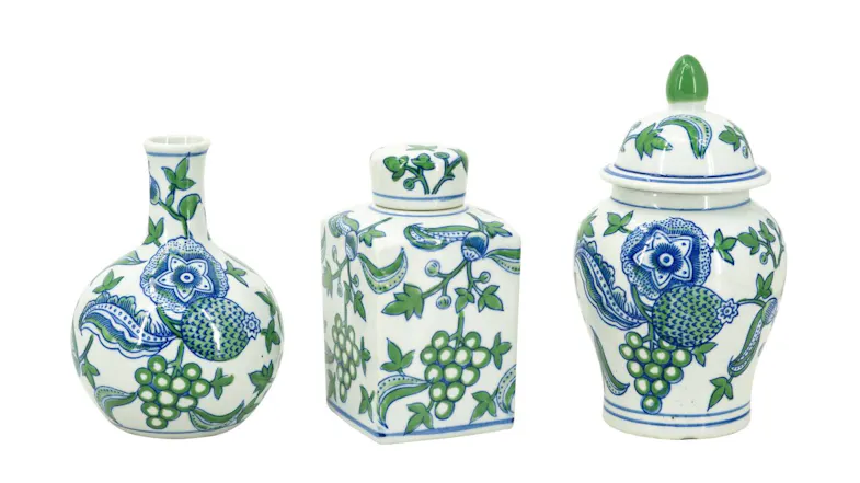 Three porcelain decorative pieces displayed side by side on a white background Three porcelain decorative pieces displayed side by side on a white background