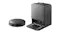 Robot vacuum and its open-top charging station side-by-side Robot vacuum and its open-top charging station side-by-side
