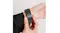 Person adjusting the black metal link bracelet on their wrist, focusing on the clasp area Person adjusting the black metal link bracelet on their wrist, focusing on the clasp area