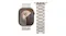 Front view of the Apple Watch next to the champagne link bracelet, laid flat Front view of the Apple Watch next to the champagne link bracelet, laid flat