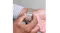 Close-up of hands fastening and adjusting the champagne link bracelet on a wrist, focusing on the clasp area Close-up of hands fastening and adjusting the champagne link bracelet on a wrist, focusing on the clasp area