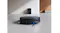 Matte black robot vacuum navigates an open, modern living space Matte black robot vacuum navigates an open, modern living space