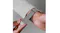 A view of a hand snapping on the watch via its magnetic clasp A view of a hand snapping on the watch via its magnetic clasp
