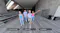 Four friends walking in a modern plaza with editing slider overlays Four friends walking in a modern plaza with editing slider overlays