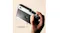 Hand holding the camera to show the screen-free back design Hand holding the camera to show the screen-free back design