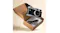 Digital camera and USB-C cable in an open brown cardboard box Digital camera and USB-C cable in an open brown cardboard box