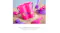 Pink sand bucket with a purple glitter name decal, labeled as non-toxic and lead-free Pink sand bucket with a purple glitter name decal, labeled as non-toxic and lead-free