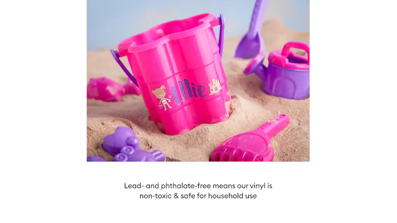 Personalised pink sand bucket and toys labeled with non-toxic, lead-free vinyl Personalised pink sand bucket and toys labeled with non-toxic, lead-free vinyl