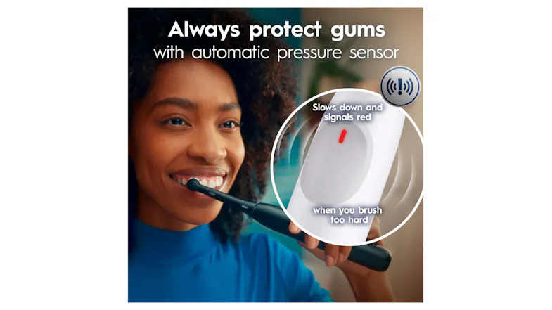 Woman brushing; inset shows red light alert for hard pressure Woman brushing; inset shows red light alert for hard pressure