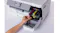 An open side compartment showing four colourful ink cartridges being installed An open side compartment showing four colourful ink cartridges being installed