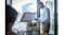A man lifting the flatbed scanner lid of the white rectangular printer A man lifting the flatbed scanner lid of the white rectangular printer