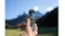 Handheld camera standing upright in tall grass with mountains behind Handheld camera standing upright in tall grass with mountains behind