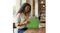 A woman at a cafe table is sliding a laptop into the case A woman at a cafe table is sliding a laptop into the case