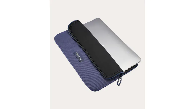 Overhead view of a laptop partially inserted into the open case Overhead view of a laptop partially inserted into the open case