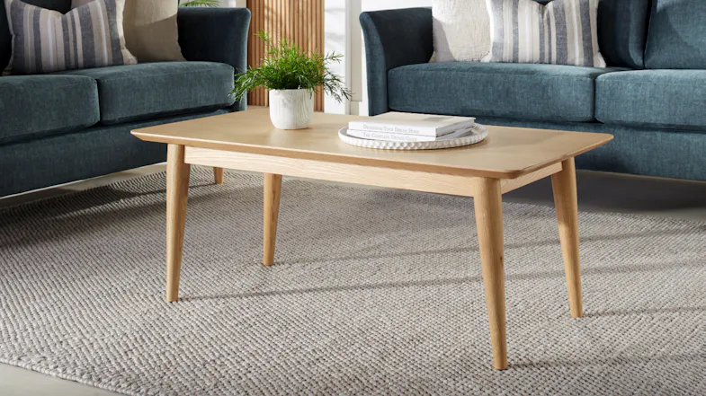 Rectangular Helsinki 1150mm coffee table in light oak, styled in a modern living room Rectangular Helsinki 1150mm coffee table in light oak, styled in a modern living room