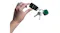 A hand holding a car key fob with a green and light blue Tile Mate tracker attached A hand holding a car key fob with a green and light blue Tile Mate tracker attached