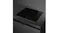 Angled perspective of the black 4‑zone Smeg induction cooktop installed flush into a dark stone benchtop Angled perspective of the black 4‑zone Smeg induction cooktop installed flush into a dark stone benchtop