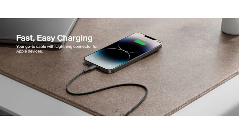 iPhone charging on a brown leather desk mat with "Fast, Easy Charging" text iPhone charging on a brown leather desk mat with "Fast, Easy Charging" text